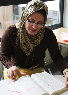 Student reading textbook