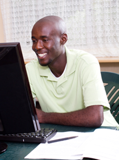 A man sitting at a computer